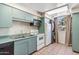 Compact kitchenette with standard appliances offering functionality in a cozy space at 6928 E 3Rd St, Scottsdale, AZ 85251
