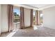 Bright and airy living room with large windows and neutral carpet, creating a comfortable atmosphere at 6928 E 3Rd St, Scottsdale, AZ 85251