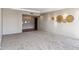 Spacious living room featuring neutral carpet and decorative wall art adding a touch of elegance at 6928 E 3Rd St, Scottsdale, AZ 85251