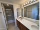 Bathroom featuring a double vanity, shower, and toilet, offering a functional layout at 6945 E Cochise Rd # 108, Paradise Valley, AZ 85253
