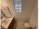 Bathroom with a single vanity, and a window for natural lighting at 6945 E Cochise Rd # 108, Paradise Valley, AZ 85253