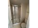 Bathroom featuring a shower with a sliding glass door, toilet, and towel bar at 6945 E Cochise Rd # 108, Paradise Valley, AZ 85253