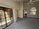 Bright bedroom with patio access and a large window, offering plenty of natural light at 6945 E Cochise Rd # 108, Paradise Valley, AZ 85253