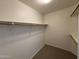 Walk-in closet with shelving, providing ample storage space at 6945 E Cochise Rd # 108, Paradise Valley, AZ 85253