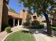 Exterior view with lush green grass, mature trees, and well-maintained common areas at 6945 E Cochise Rd # 108, Paradise Valley, AZ 85253
