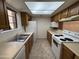 Functional kitchen featuring neutral countertops and appliances, providing practicality and efficiency at 6945 E Cochise Rd # 108, Paradise Valley, AZ 85253