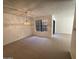 Bright living room with carpet, neutral walls, and window overlooking the outdoors at 6945 E Cochise Rd # 108, Paradise Valley, AZ 85253