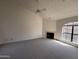 Bright living room with large windows and a fireplace, offering a cozy atmosphere at 6945 E Cochise Rd # 108, Paradise Valley, AZ 85253