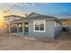A tranquil backyard showcasing a covered patio, ideal for outdoor relaxation and entertainment at 7433 W Buckhorn Trl, Peoria, AZ 85383