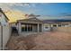 Expansive backyard featuring a covered patio and ample space for creating your ideal outdoor oasis at 7433 W Buckhorn Trl, Peoria, AZ 85383