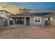 Backyard view with covered patio, offering space and potential for landscaping or outdoor activities at 7433 W Buckhorn Trl, Peoria, AZ 85383