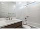 Bright bathroom featuring a shower over tub, modern vanity, and stylish fixtures at 7433 W Buckhorn Trl, Peoria, AZ 85383
