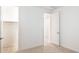 Inviting bedroom adjacent to walk-in closet, with carpeted floor and modern door at 7433 W Buckhorn Trl, Peoria, AZ 85383