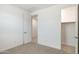 Comfortable bedroom with a walk-in closet and a carpeted floor at 7433 W Buckhorn Trl, Peoria, AZ 85383
