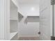 Walk-in closet with shelving and hanging rods for organized storage at 7433 W Buckhorn Trl, Peoria, AZ 85383