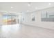 Bright living room with white tile floors and lots of natural light at 7433 W Buckhorn Trl, Peoria, AZ 85383