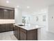 Bright, open-concept kitchen flows into a spacious living area with ample natural light at 7433 W Buckhorn Trl, Peoria, AZ 85383