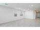 A bright living room featuring white walls and modern light wood floors at 7433 W Buckhorn Trl, Peoria, AZ 85383