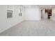 Bright living room with neutral walls, wood-look flooring, and large windows at 7433 W Buckhorn Trl, Peoria, AZ 85383