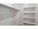 Spacious walk-in closet with shelving and ample storage space for organizing clothes and accessories at 7433 W Buckhorn Trl, Peoria, AZ 85383