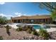 Expansive backyard featuring a pool, spa, rock accents, and desert landscaping, ideal for outdoor living at 8400 E Dixileta Dr # 153, Scottsdale, AZ 85266