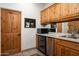 Cozy bar area with custom cabinets, wine fridge, and modern sink at 8400 E Dixileta Dr # 153, Scottsdale, AZ 85266