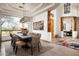 Elegant dining room featuring modern chandelier, large windows, and desert views at 8400 E Dixileta Dr # 153, Scottsdale, AZ 85266