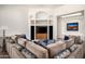 Comfortable living room with sectional sofa, media center, and accent lighting at 8400 E Dixileta Dr # 153, Scottsdale, AZ 85266