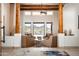 Inviting living room featuring wood beams, neutral furnishings, and scenic desert views at 8400 E Dixileta Dr # 153, Scottsdale, AZ 85266