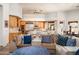 Open living area with modern kitchen, wood cabinets, and comfortable seating at 8400 E Dixileta Dr # 153, Scottsdale, AZ 85266