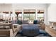 Stylish living room features comfortable seating, blue accent pillows, and views of the desert landscape at 8400 E Dixileta Dr # 153, Scottsdale, AZ 85266
