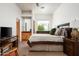 Bright main bedroom with wood floors, large windows, ensuite bath, and walk-in closet at 8400 E Dixileta Dr # 153, Scottsdale, AZ 85266
