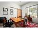 Bright office space with a natural light, wooden table, and a beautiful landscape view at 8400 E Dixileta Dr # 153, Scottsdale, AZ 85266