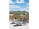 Outdoor lounge chairs offer stunning views of the desert landscape and mountains at 8400 E Dixileta Dr # 153, Scottsdale, AZ 85266