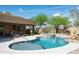 A beautiful pool and jacuzzi featuring rock details and desert landscaping at 8400 E Dixileta Dr # 153, Scottsdale, AZ 85266
