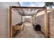 Backyard gardening area with raised planters and a composting bin under a shade structure at 863 W Kiva Ave, Mesa, AZ 85210