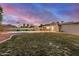 Lush backyard with a bright pool, grass area, and large covered patio, perfect for outdoor living at 863 W Kiva Ave, Mesa, AZ 85210