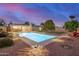 A sprawling backyard includes a luminous pool, outdoor seating, and meticulously kept landscaping at 863 W Kiva Ave, Mesa, AZ 85210