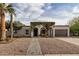 Charming single-level home with an inviting entrance framed by verdant vines at 863 W Kiva Ave, Mesa, AZ 85210