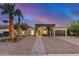 Charming home with desert landscaping, a brick pathway and arched entry featuring lush vine coverage at 863 W Kiva Ave, Mesa, AZ 85210