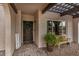 Welcoming front porch with cozy seating, decorative accents, and a shade-providing pergola at 863 W Kiva Ave, Mesa, AZ 85210