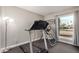 Home gym featuring a treadmill and inversion table, perfect for maintaining an active lifestyle at 863 W Kiva Ave, Mesa, AZ 85210
