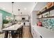 Bright kitchen featuring a large island, pendant lighting, stainless steel appliances and stylish backsplash at 863 W Kiva Ave, Mesa, AZ 85210