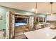 Well-lit kitchen featuring quartz countertops, stainless steel appliances, and an open view of an outdoor pool area at 863 W Kiva Ave, Mesa, AZ 85210