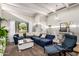 Inviting living area with a comfortable couch, bright natural light, and views of the outdoors at 863 W Kiva Ave, Mesa, AZ 85210