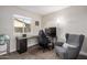 Functional office with a desk, computer, ergonomic chair and large window overlooking backyard at 863 W Kiva Ave, Mesa, AZ 85210