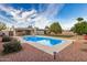 Backyard with refreshing pool, grassy area, mature landscaping, and outdoor entertaining space at 863 W Kiva Ave, Mesa, AZ 85210