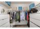 Well-organized walk-in closet with shelving, drawers, and hanging space for clothing and storage at 863 W Kiva Ave, Mesa, AZ 85210