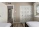 Bedroom with twin beds, a large closet, and direct access to the bathroom at 8637 E Weldon Ave, Scottsdale, AZ 85251
