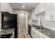 Modern kitchen featuring granite countertops, stainless steel appliances, and white subway tile backsplash at 8637 E Weldon Ave, Scottsdale, AZ 85251